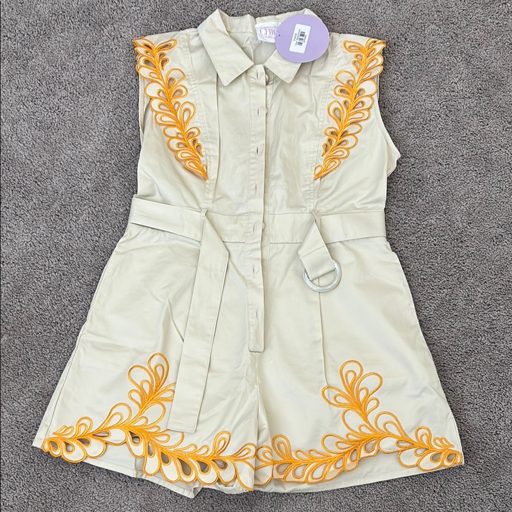 Chic Cream Romper with Orange Detailing